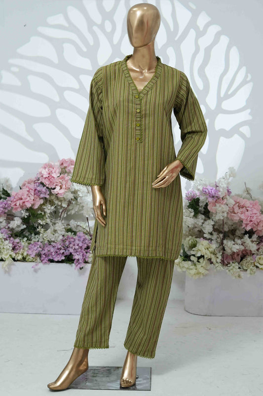 Mannequin wearing a green striped outfit with flowers in the background